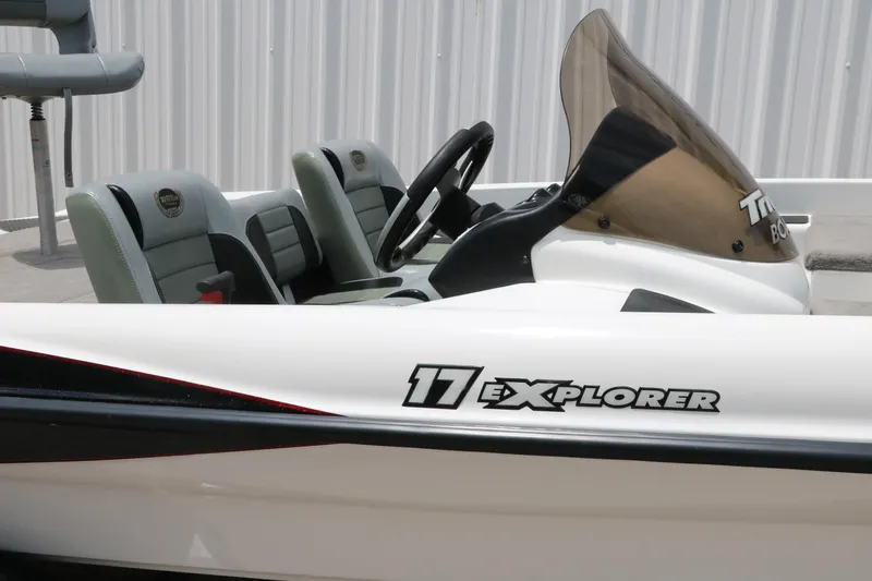 Slide: The Image of 2009 Triton 17 Explorer boat interior with windshield and seating. - 13