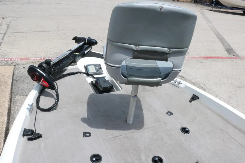 Slide: The Image of 2009 Triton 17 Explorer boat deck with seat and trolling motor. - 18