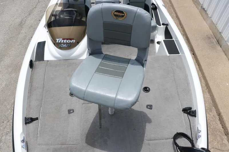 Slide: The Image of 2009 Triton 17 Explorer boat with gray seating and carpeted deck. - 21