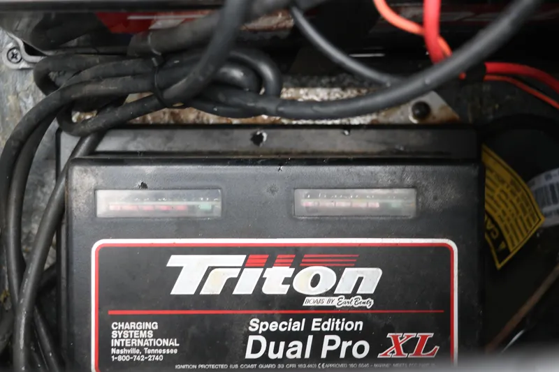 Slide: The Image of Battery compartment of a 2009 Triton 17 Explorer with Dual Pro XL charger. - 27