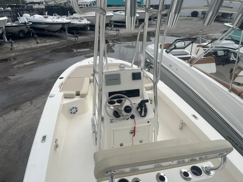 Slide: The Image of Pathfinder 2005 TRS boat, 2022 model, docked with steering console and seating area. - 11