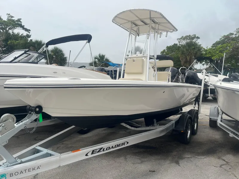Slide: The Image of Pathfinder 2005 TRS boat on trailer, 2022 model, parked outdoors. - 3