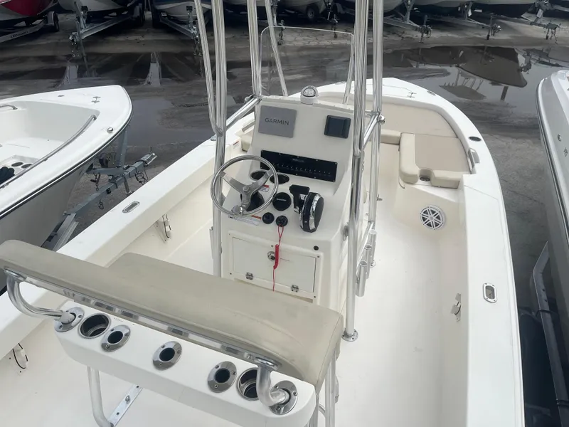 Slide: The Image of Center console of a 2022 Pathfinder 2005 TRS boat with steering wheel and controls. - 6