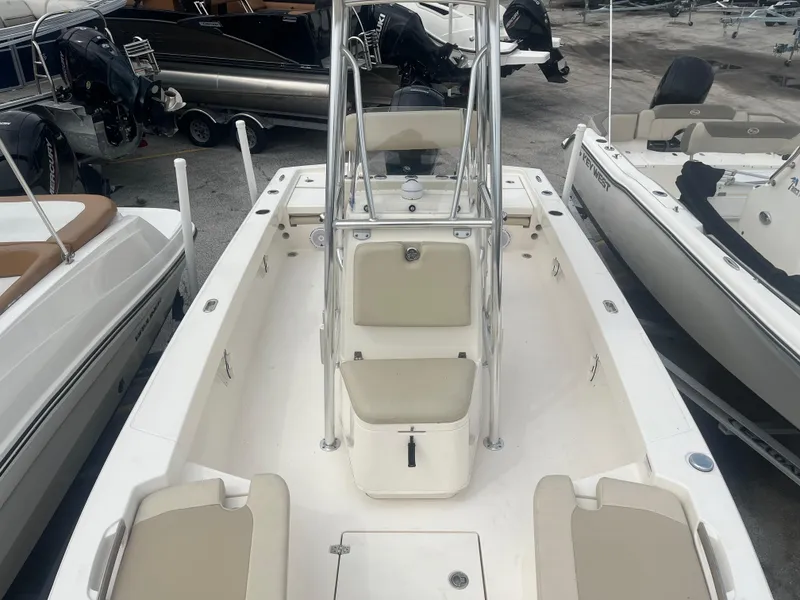 Slide: The Image of Open deck of a 2022 Pathfinder 2005 TRS boat, featuring seating and a center console. - 8