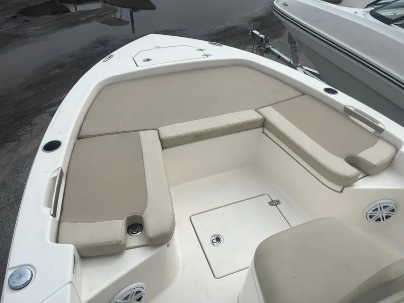 Slide: The Image of Bow seating area of a 2022 Pathfinder 2005 TRS boat with beige cushions. - 9