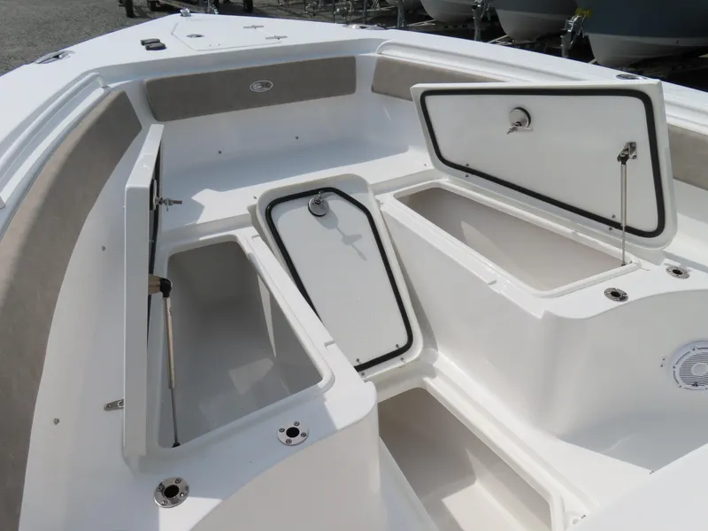 Slide: The Image of 2025 Sea Hunt Gamefish 25 boat with open storage compartments. - 10