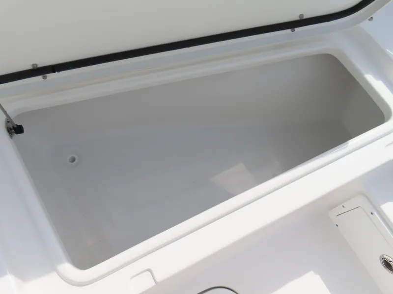 Slide: The Image of Open storage compartment on a 2025 Sea Hunt Gamefish 25 boat. - 12