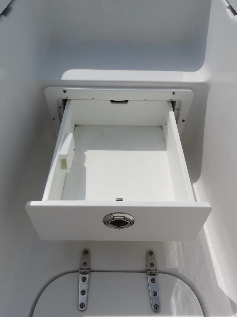Slide: The Image of Open storage compartment on 2025 Sea Hunt Gamefish 25 boat. - 14