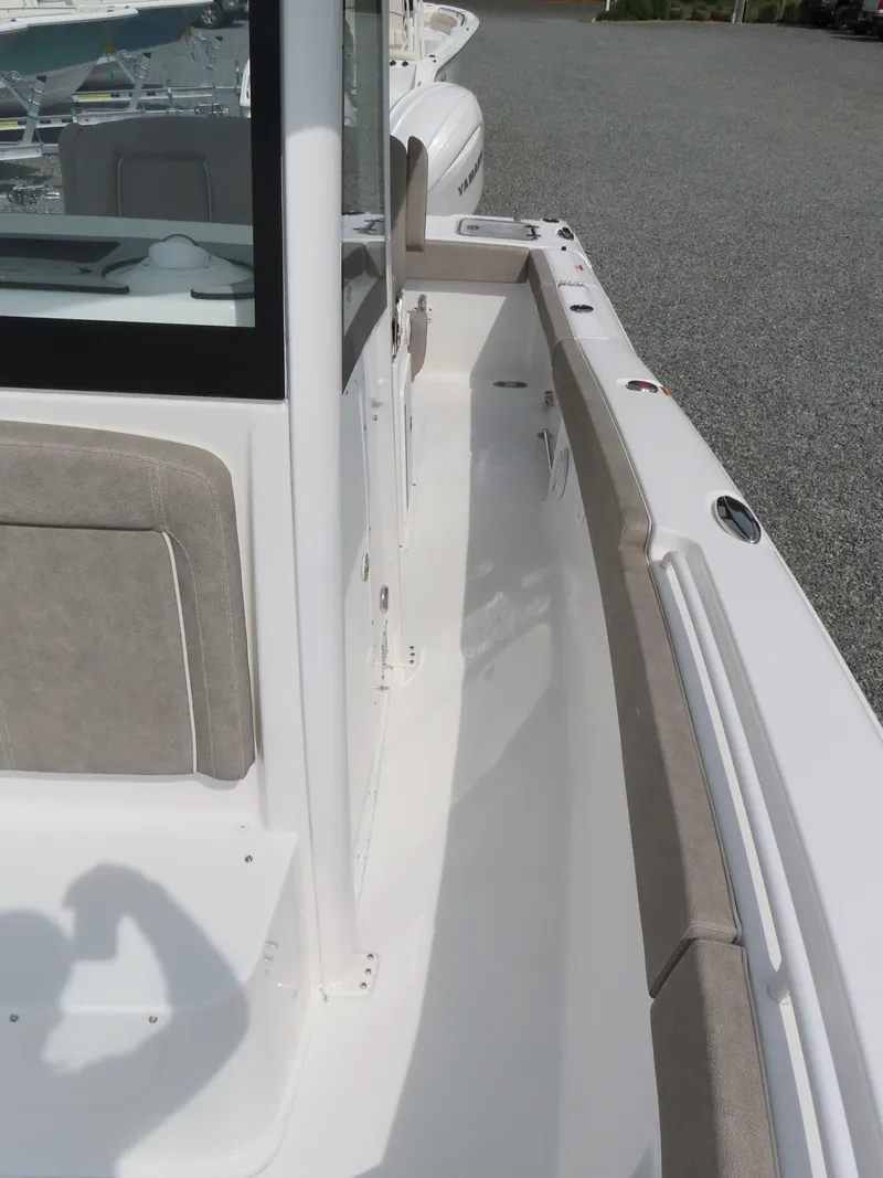 Slide: The Image of 2025 Sea Hunt Gamefish 25 boat deck, featuring sleek design and comfortable seating. - 19