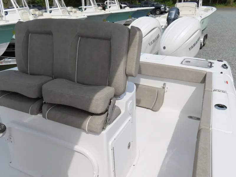 Slide: The Image of 2025 Sea Hunt Gamefish 25 boat interior with dual Yamaha engines and cushioned seating. - 22