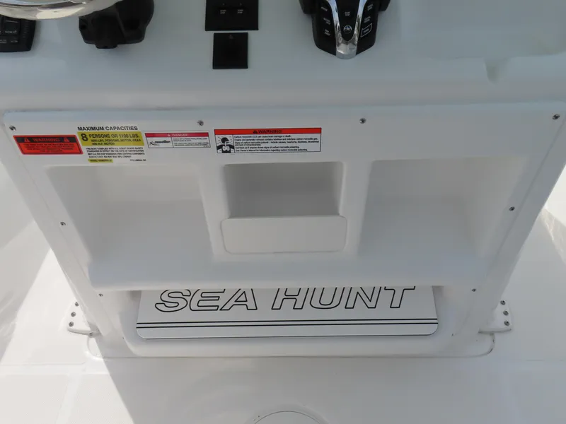 Slide: The Image of 2025 Sea Hunt Gamefish 25 boat console with branding and controls. - 26