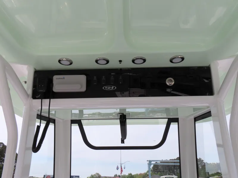 Slide: The Image of 2025 Sea Hunt Gamefish 25 boat console with electronics and lighting. - 27