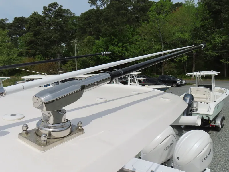Slide: The Image of 2025 Sea Hunt Gamefish 25 boat with Yamaha engines and fishing outriggers. - 30