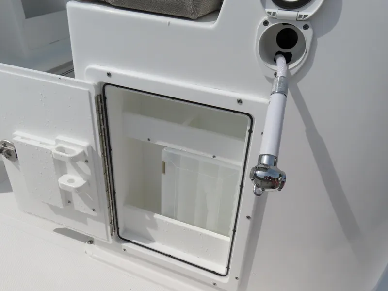 Slide: The Image of 2025 Sea Hunt Gamefish 25 boat storage compartment with hose attachment. - 34