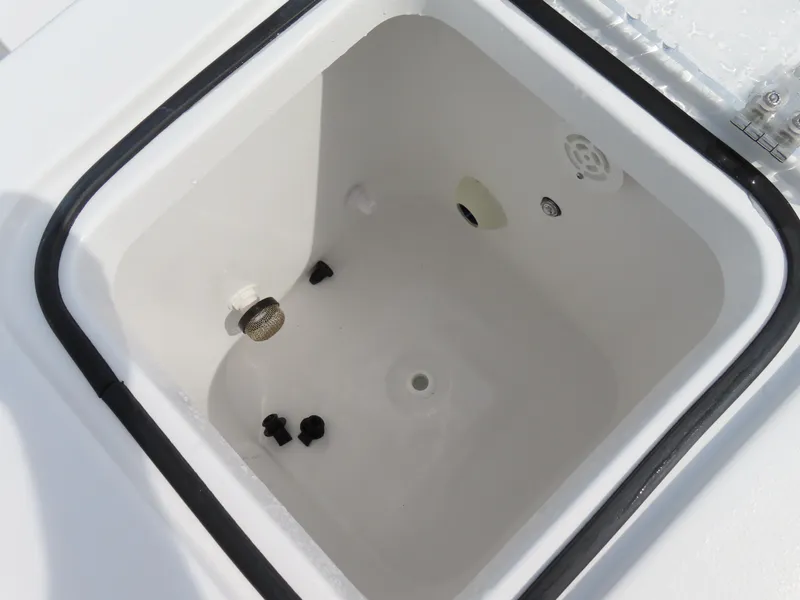 Slide: The Image of Livewell compartment on 2025 Sea Hunt Gamefish 25 boat, featuring drainage and aeration systems. - 44