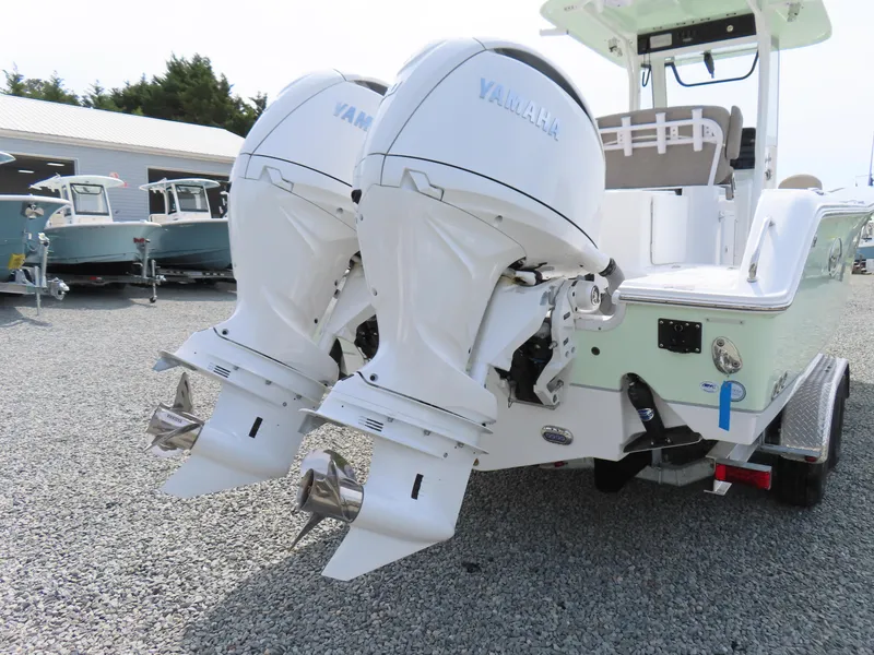 Slide: The Image of 2025 Sea Hunt Gamefish 25 with dual Yamaha outboard engines on a trailer. - 5