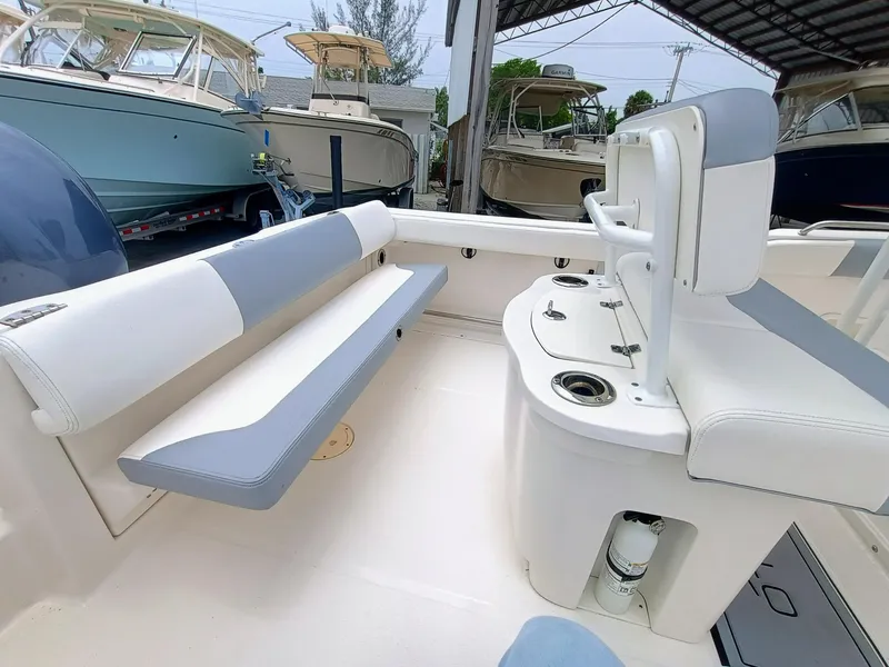 Slide: The Image of 2023 Robalo R222 Center Console boat interior with seating and console features. - 12