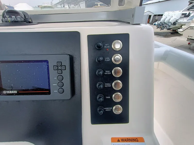 Slide: The Image of 2023 Robalo R222 Center Console dashboard with Yamaha display and control panel. - 16