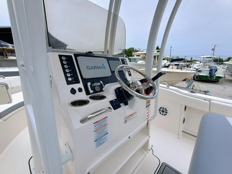 Slide: The Image of 2023 Robalo R222 Center Console boat dashboard with Garmin navigation system. - 19