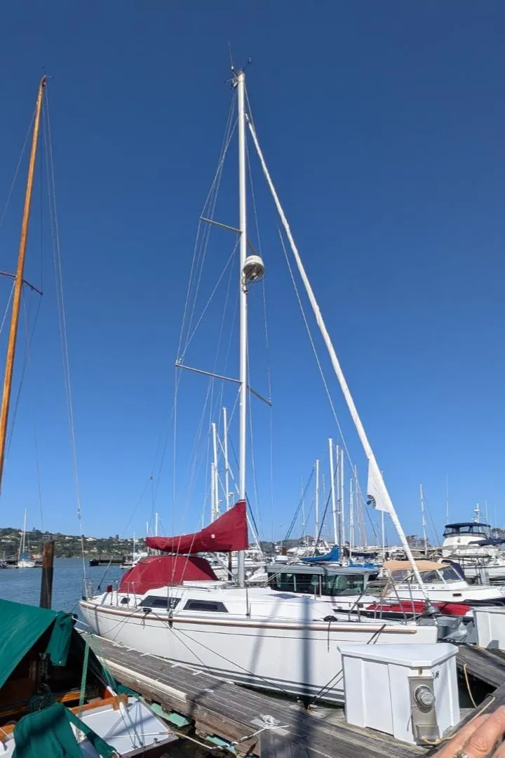 Slide: The Image of 2014 Hanse 325 sailboat docked at marina under clear blue sky. - 18