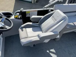 Slide: The Image of Captain's chair on 2023 Sweetwater 2286SBX boat, featuring sleek gray upholstery. - 5