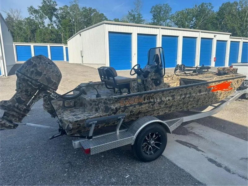 The Image of 2025 Excel 1860 F4 Shallow Water Pro Console boat with camouflage design on a trailer. - 1