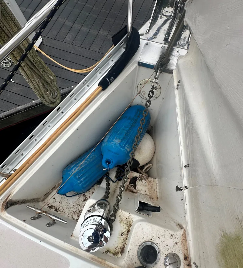 Slide: The Image of Anchor chain and fender on 1998 Catalina 400 sailboat deck. - 11