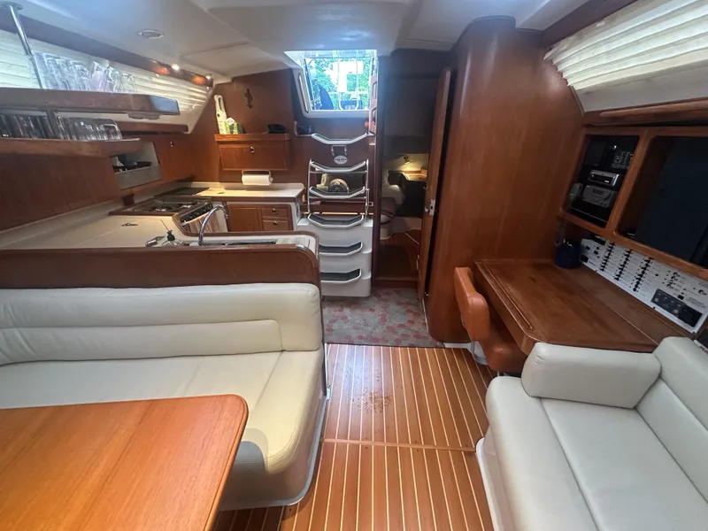 Slide: The Image of Interior of 1998 Catalina 400 sailboat with wood finish and comfortable seating. - 23