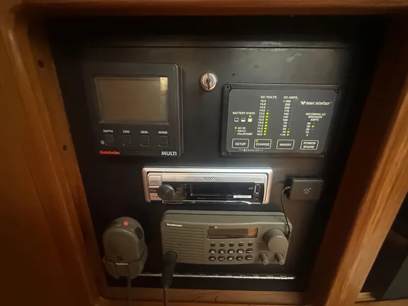 Slide: The Image of Control panel of a 1998 Catalina 400 yacht with navigation and communication equipment. - 27