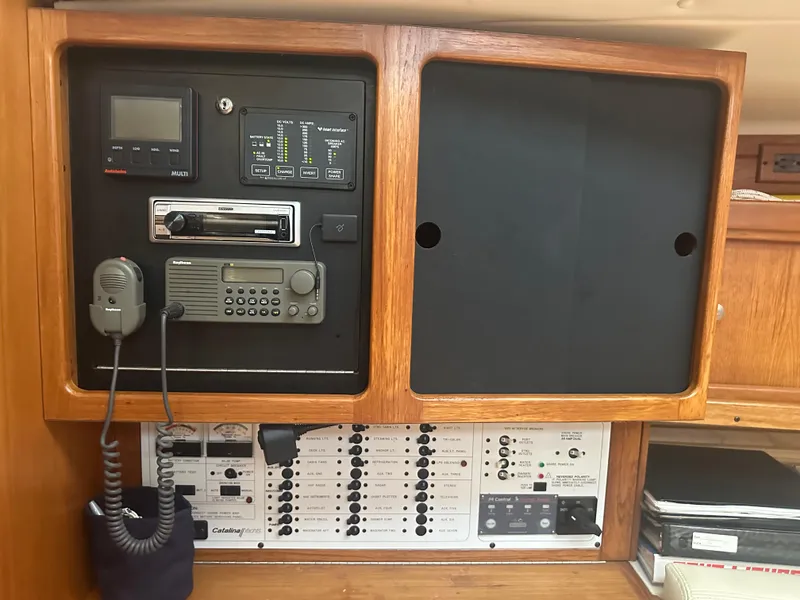 Slide: The Image of Control panel of a 1998 Catalina 400 sailboat with communication and navigation equipment. - 28