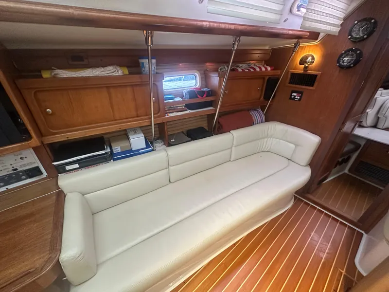Slide: The Image of Interior of 1998 Catalina 400 yacht with cream sofa and wooden cabinetry. - 31