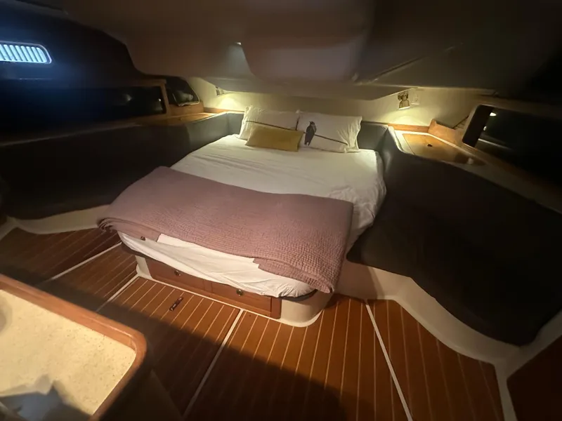 Slide: The Image of Cozy cabin interior of 1998 Catalina 400 sailboat with bed and wooden flooring. - 42