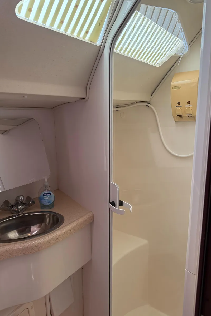 Slide: The Image of Interior of 1998 Catalina 400 yacht bathroom with sink and shower. - 52