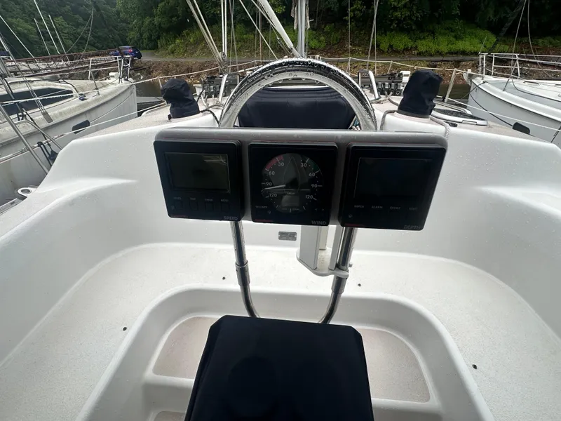 Slide: The Image of Cockpit of 1998 Catalina 400 sailboat with steering wheel and instrument panel. - 7