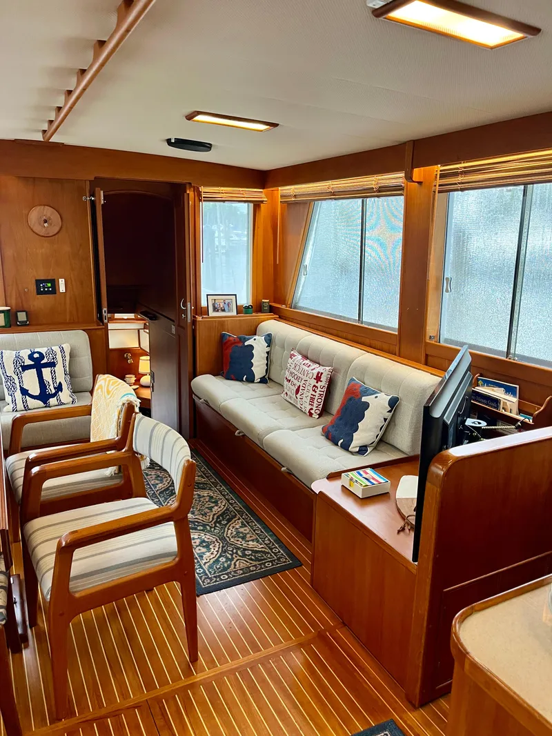 Slide: The Image of Interior of 1997 Grand Banks 49 Classic yacht with wooden decor and comfortable seating. - 10