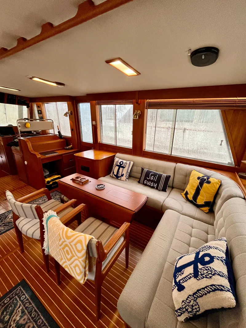 Slide: The Image of Interior of 1997 Grand Banks 49 Classic yacht with cozy seating and nautical decor. - 12