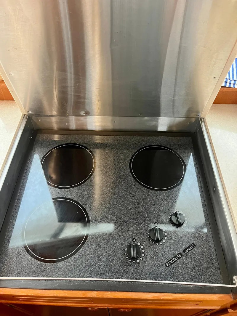 Slide: The Image of Stainless steel stovetop with four burners on a 1997 Grand Banks 49 Classic yacht. - 17