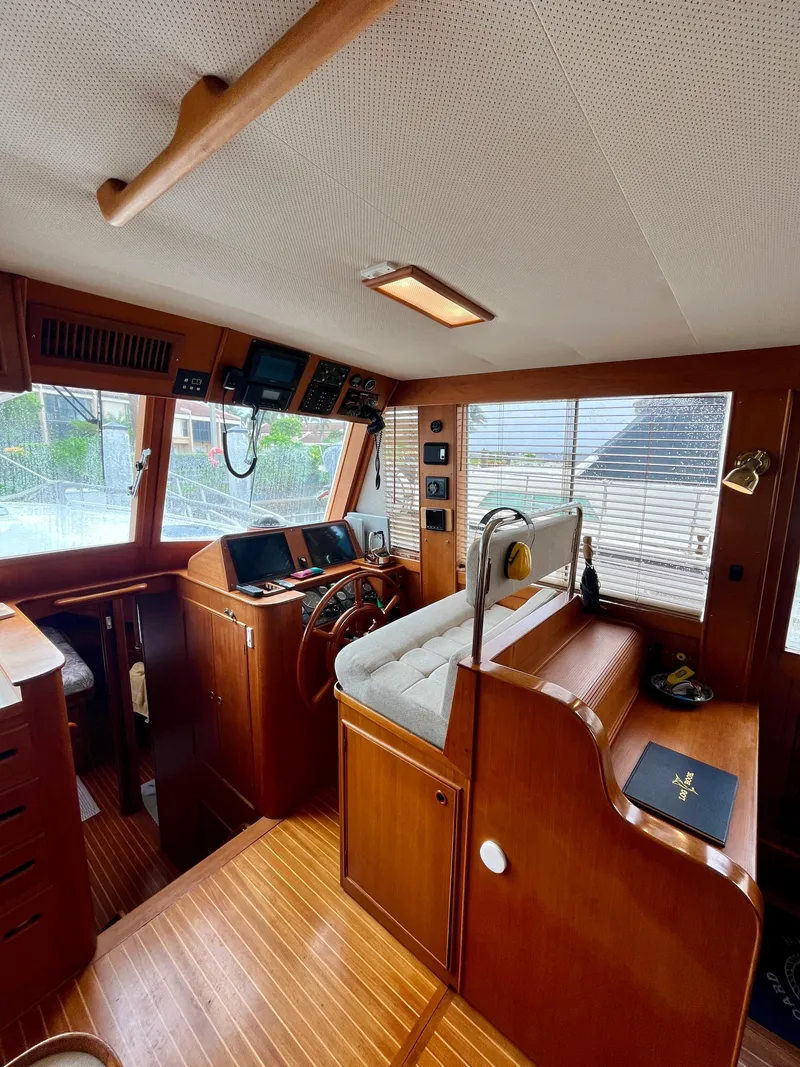 Slide: The Image of Interior of 1997 Grand Banks 49 Classic yacht with wooden finishes and navigation equipment. - 21