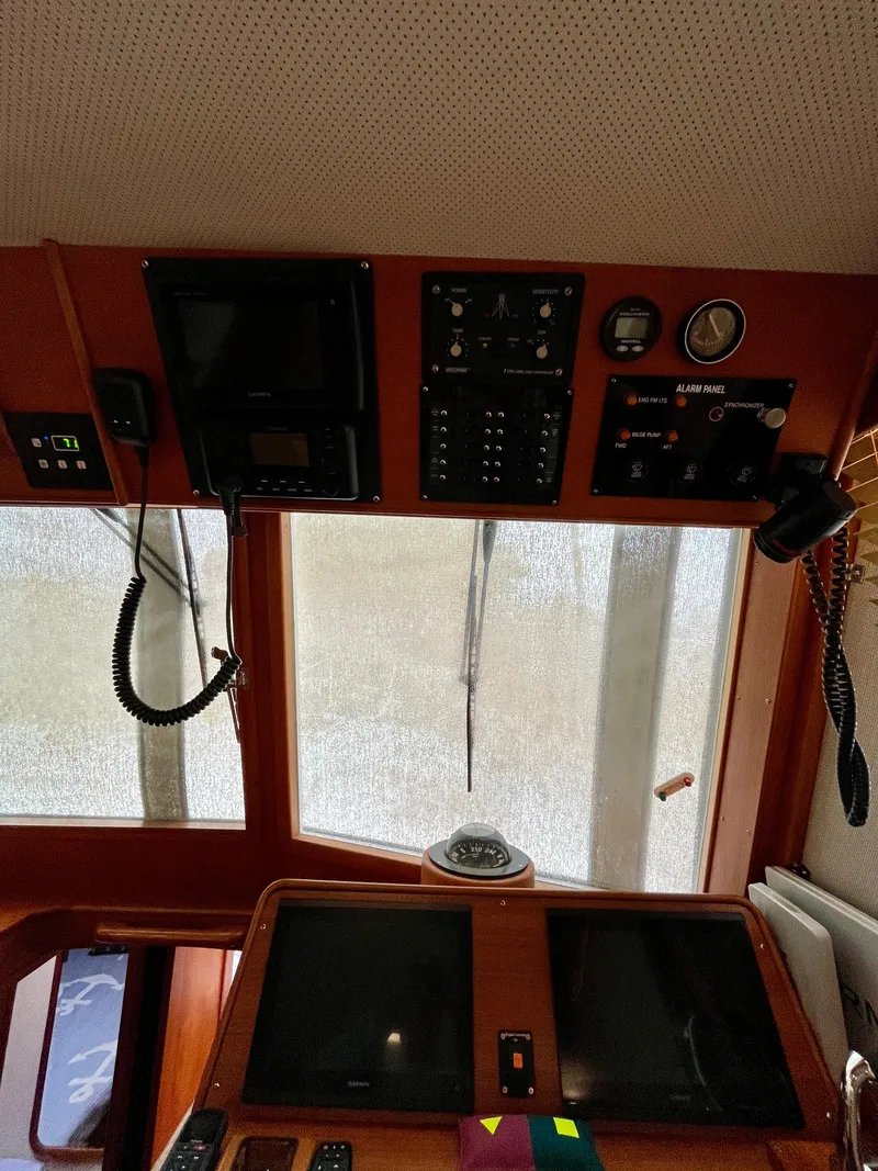 Slide: The Image of Interior view of 1997 Grand Banks 49 Classic yacht helm with navigation instruments. - 24