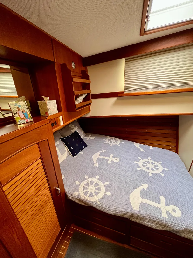 Slide: The Image of Cozy cabin interior of 1997 Grand Banks 49 Classic with nautical-themed bedding. - 28