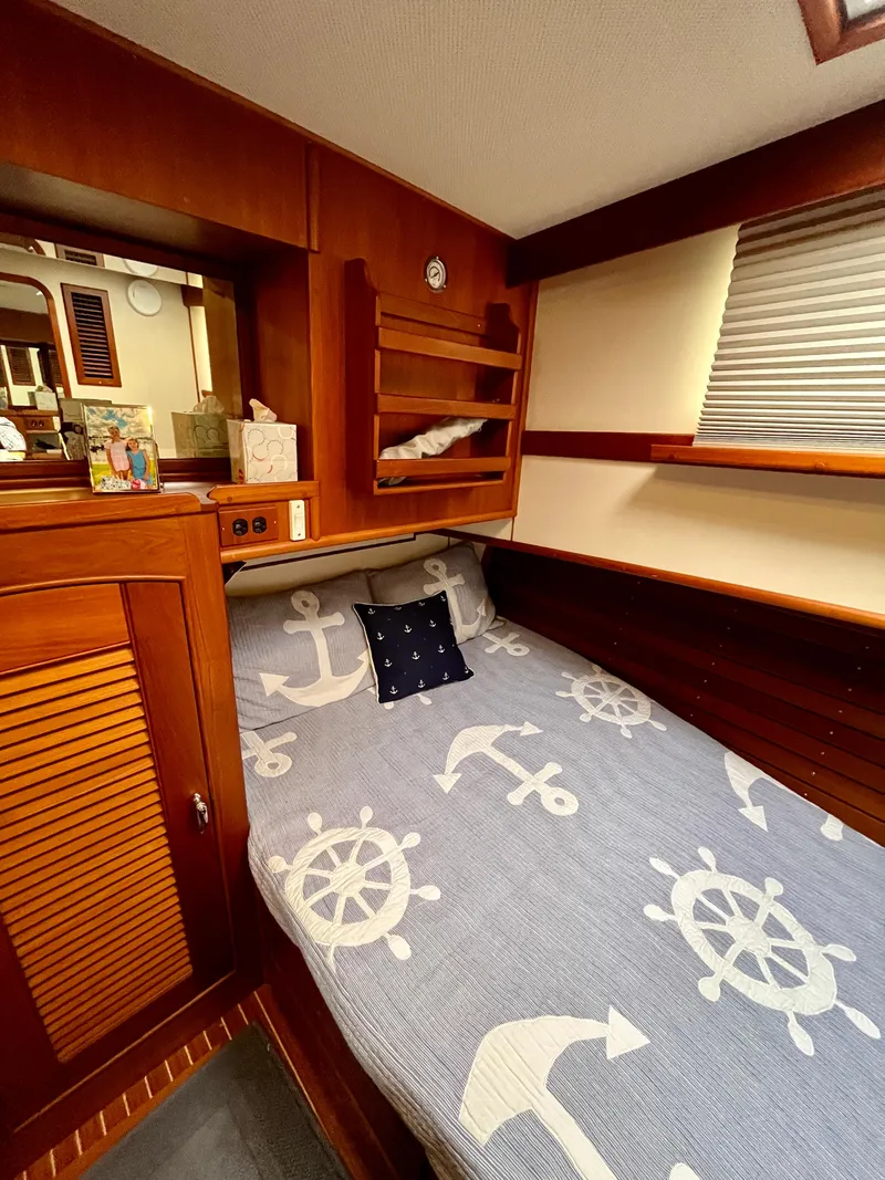 Slide: The Image of Cozy cabin interior of 1997 Grand Banks 49 Classic with nautical-themed bedding. - 29