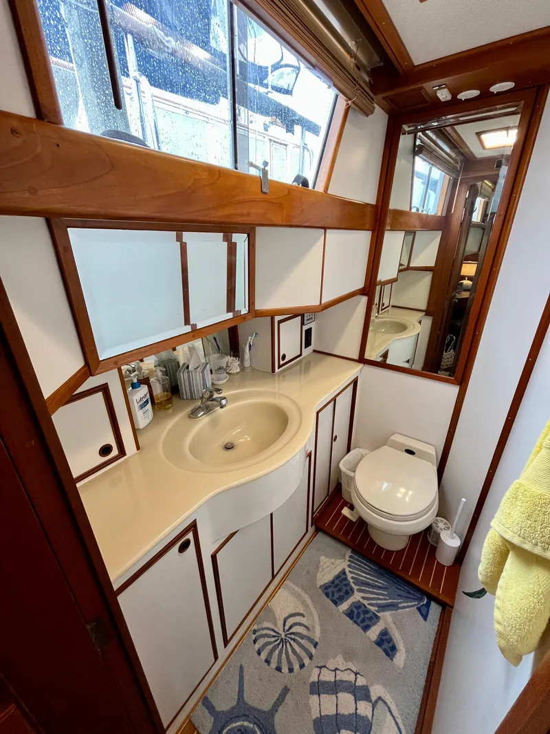 Slide: The Image of Bathroom interior of 1997 Grand Banks 49 Classic yacht, featuring sink and toilet. - 36