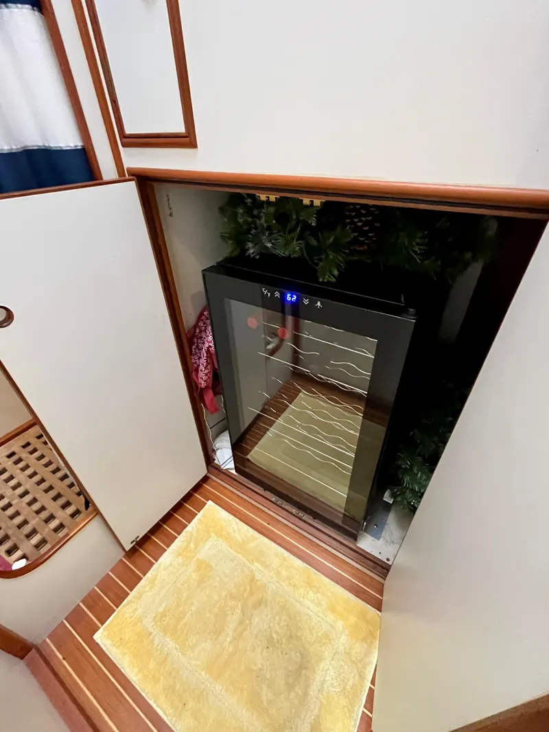 Slide: The Image of 1997 Grand Banks 49 Classic interior with a built-in wine cooler. - 38