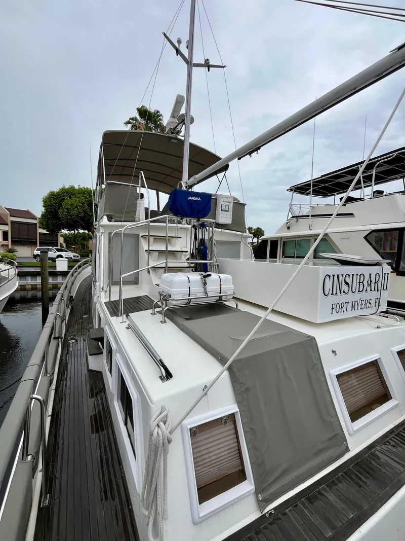 Slide: The Image of 1997 Grand Banks 49 Classic yacht docked, featuring a spacious deck and modern amenities. - 40