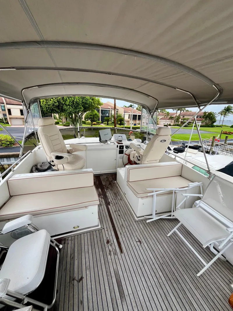 Slide: The Image of Spacious deck of 1997 Grand Banks 49 Classic yacht with seating and helm station. - 44
