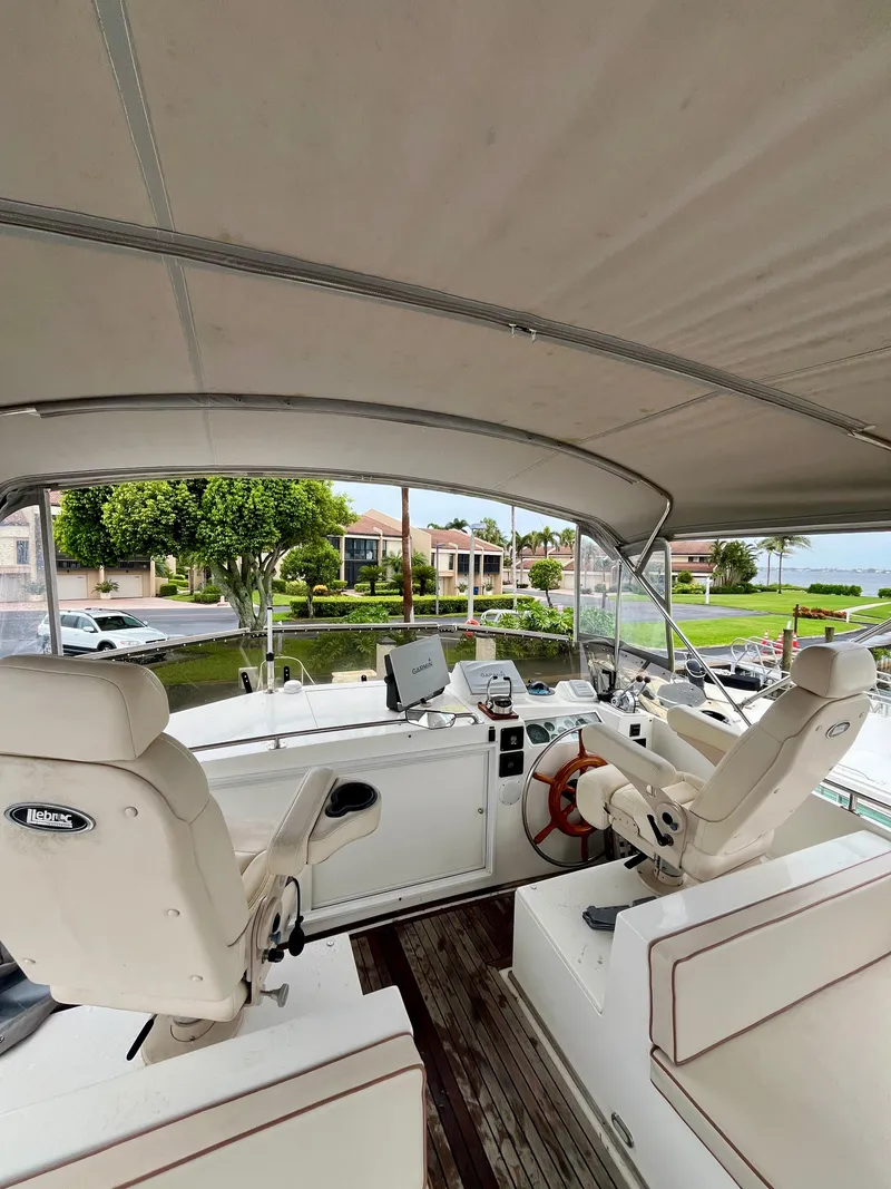 Slide: The Image of 1997 Grand Banks 49 Classic yacht helm with dual seats and navigation equipment. - 45