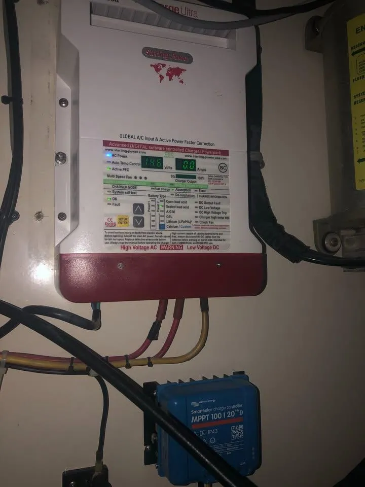 Slide: The Image of Electrical panel inside a 2001 Cabo 35 Express boat, featuring various control components. - 13