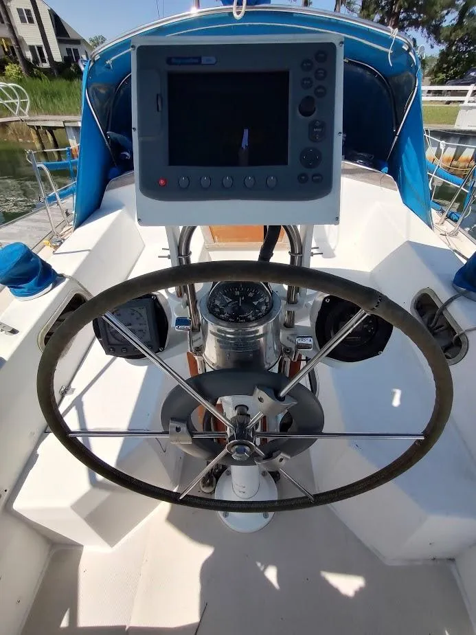 Slide: The Image of Steering wheel and navigation equipment on a 1987 Catalina C-34 sailboat. - 14