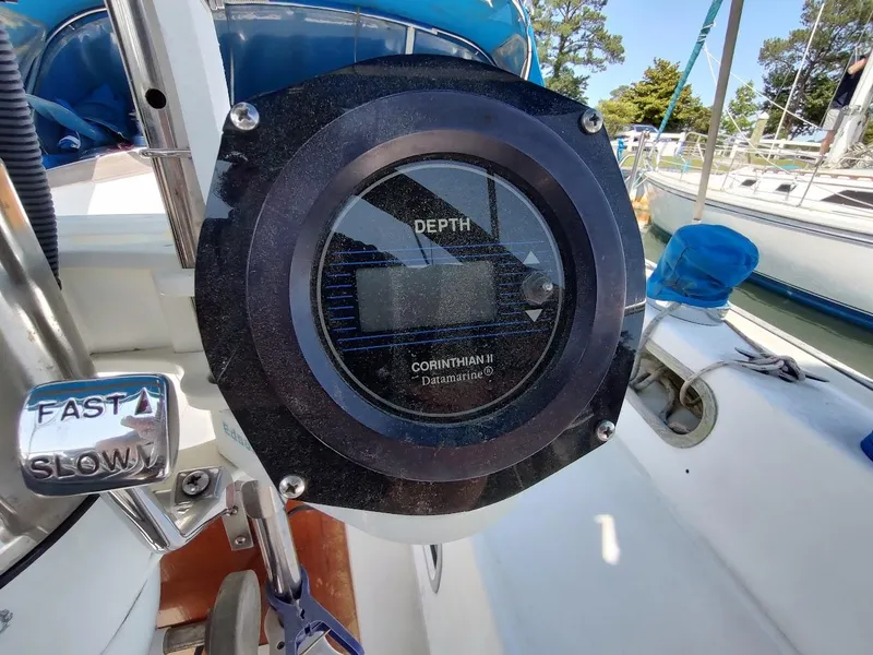 Slide: The Image of Depth gauge and throttle control on a 1987 Catalina C-34 sailboat cockpit. - 17