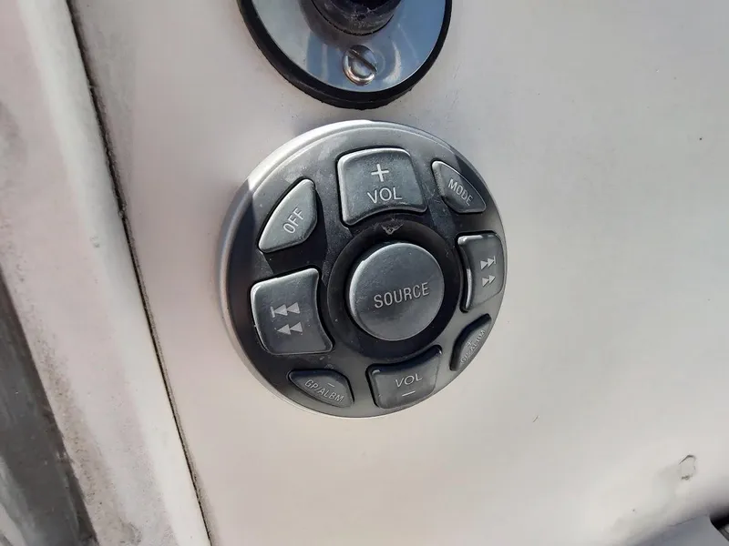 Slide: The Image of Audio control panel on a 1987 Catalina C-34 boat, featuring various function buttons. - 21